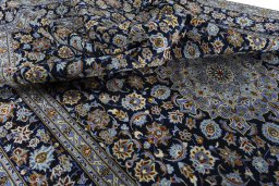 Surface texture of 2000s Kashan rug with natural Wool and intricate pattern