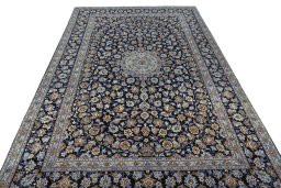 Surface texture of 2000s Kashan rug with natural Wool and intricate pattern