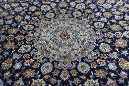 Central medallion detail of 2000s Kashan rug from Iran / Persia