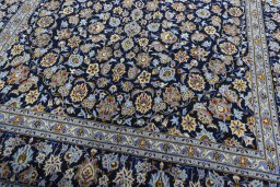 Close-up detail of 2000s Kashan rug from Iran / Persia showing Wool weave