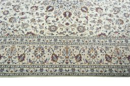 Corner detail of 2000s Kashan rug showing border pattern and Wool pile