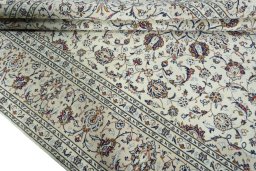 Close-up detail of 2000s Kashan rug from Iran / Persia showing Wool weave