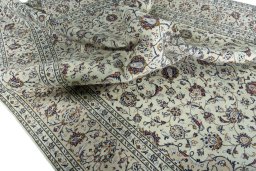 Surface texture of 2000s Kashan rug with natural Wool and intricate pattern