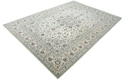 Corner detail of 2000s Kashan rug showing border pattern and Wool pile