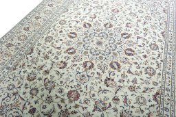 Backside of handmade 2000s Kashan rug showing knot structure and weave density