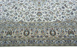 Corner detail of 2000s Kashan rug showing border pattern and Wool pile