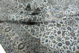 Surface texture of 2000s Kashan rug with natural Wool and intricate pattern