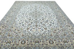 Surface texture of 2000s Kashan rug with natural Wool and intricate pattern