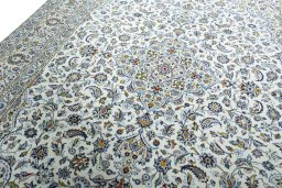 Backside of handmade 2000s Kashan rug showing knot structure and weave density