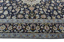 Corner detail of 1970s Kashan rug showing border pattern and Wool pile
