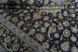 Close-up detail of 1970s Kashan rug from Iran / Persia showing Wool weave