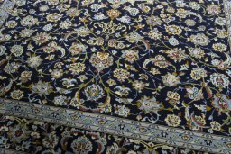 Close-up detail of 1970s Kashan rug from Iran / Persia showing Wool weave