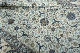 Close-up detail of 2000s Kashan rug from Iran / Persia showing Wool weave
