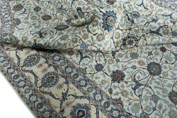 Surface texture of 2000s Kashan rug with natural Wool and intricate pattern