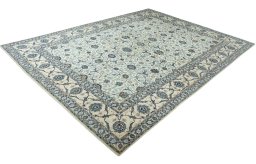 Corner detail of 2000s Kashan rug showing border pattern and Wool pile