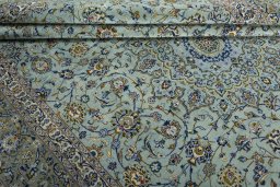 Close-up detail of 2000s Kashan rug from Iran / Persia showing Wool weave