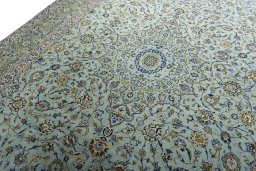 Backside of handmade 2000s Kashan rug showing knot structure and weave density