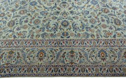 Corner detail of 1970s Kashan rug showing border pattern and Wool pile