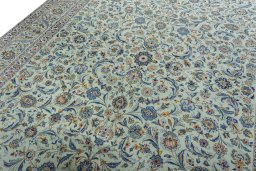 Backside of handmade 1970s Kashan rug showing knot structure and weave density