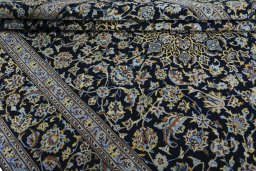 Close-up detail of New Kashan rug from Iran / Persia showing Wool weave