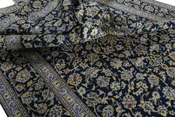 Surface texture of New Kashan rug with natural Wool and intricate pattern