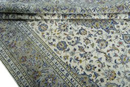 Close-up detail of 2000s Kashan rug from Iran / Persia showing Wool weave