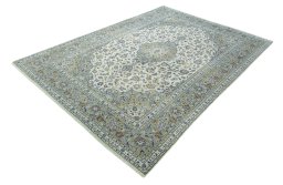 Corner detail of 2000s Kashan rug showing border pattern and Wool pile