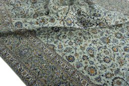 Surface texture of 2000s Kashan rug with natural Wool and intricate pattern