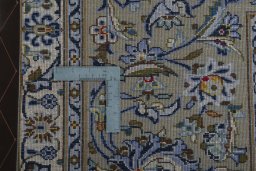 Backside of handmade 2000s Kashan rug showing knot structure and weave density