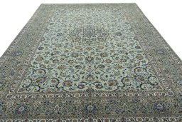 Surface texture of 2000s Kashan rug with natural Wool and intricate pattern