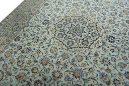 Backside of handmade 2000s Kashan rug showing knot structure and weave density