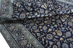 Surface texture of 2000s Kashan rug with natural Wool and intricate pattern