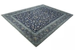 Corner detail of 2000s Kashan rug showing border pattern and Wool pile