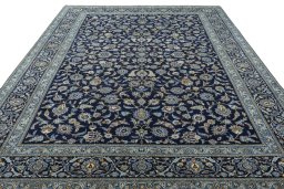 Surface texture of 2000s Kashan rug with natural Wool and intricate pattern