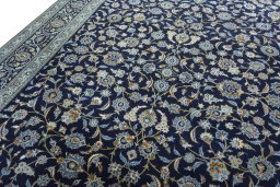Backside of handmade 2000s Kashan rug showing knot structure and weave density