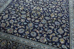 Close-up detail of 2000s Kashan rug from Iran / Persia showing Wool weave