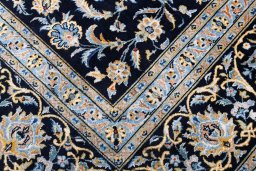 Close-up detail of 2000s Kashan rug from Iran / Persia showing Wool weave