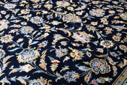 Surface texture of 2000s Kashan rug with natural Wool and intricate pattern