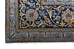 Close-up detail of 2000s Kashan rug from Iran / Persia showing Wool weave