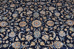 Close-up detail of 2000s Kashan rug from Iran / Persia showing Wool weave