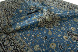 Surface texture of 2000s Kashan rug with natural Wool and intricate pattern