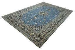 Corner detail of 2000s Kashan rug showing border pattern and Wool pile