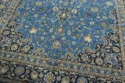 Close-up detail of 2000s Kashan rug from Iran / Persia showing Wool weave