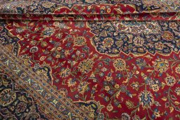 Close-up detail of 2000s Kashan rug from Iran / Persia showing Wool weave