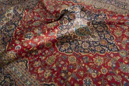 Surface texture of 2000s Kashan rug with natural Wool and intricate pattern