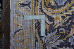 Backside of handmade 2000s Kashan rug showing knot structure and weave density