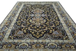 Surface texture of 2000s Kashan rug with natural Wool and intricate pattern