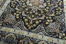 Close-up detail of 2000s Kashan rug from Iran / Persia showing Wool weave