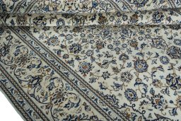 Close-up detail of 2000s Kashan rug from Iran / Persia showing Wool weave