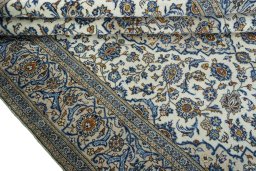 Close-up detail of 2000s Kashan rug from Iran / Persia showing Wool weave